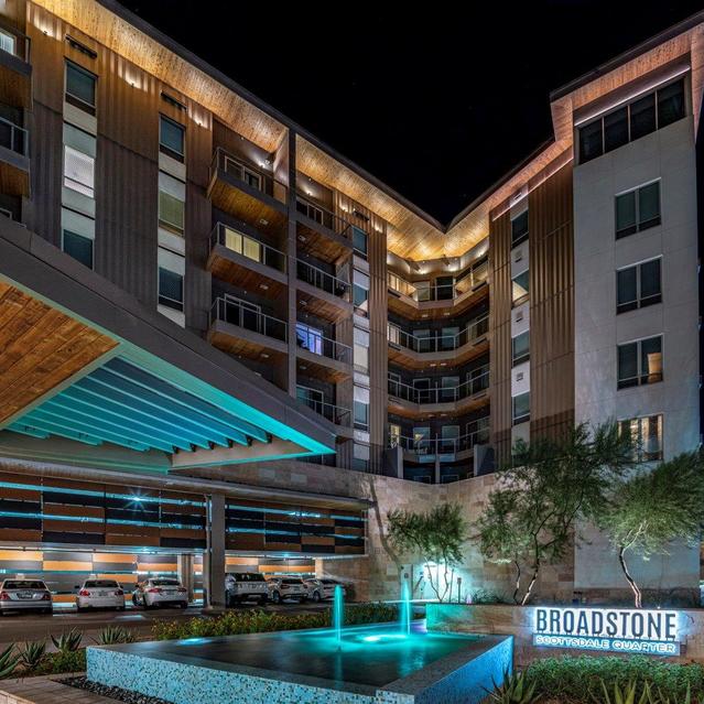 Broadstone Scottsdale Quarter – Contemporary Building with Fountain at Night