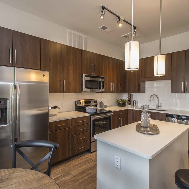 Broadstone Scottsdale Quarter – Modern Kitchen with Stainless Steel Appliances and Center Island